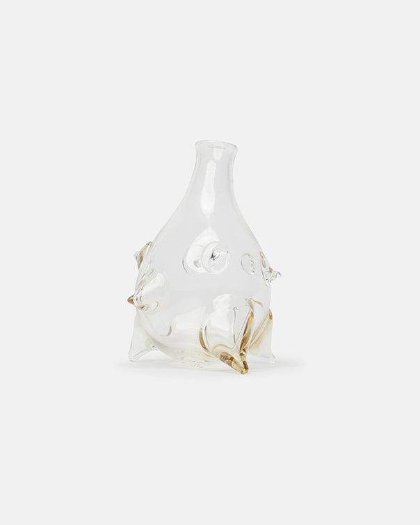 Clear glass vase with gold accents on a white background