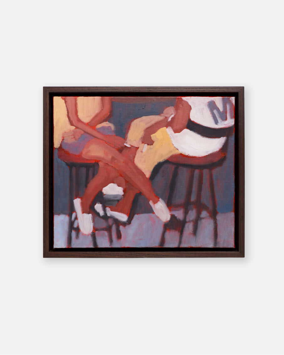 Framed artwork of two people sitting on stools with a white background