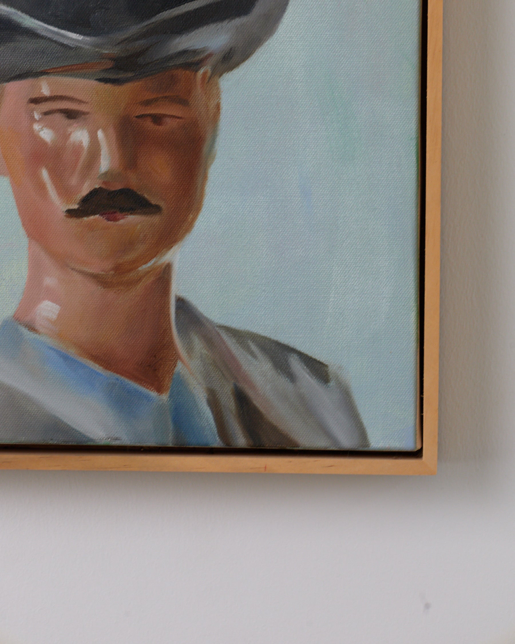 Close-up of a framed portrait on a wall