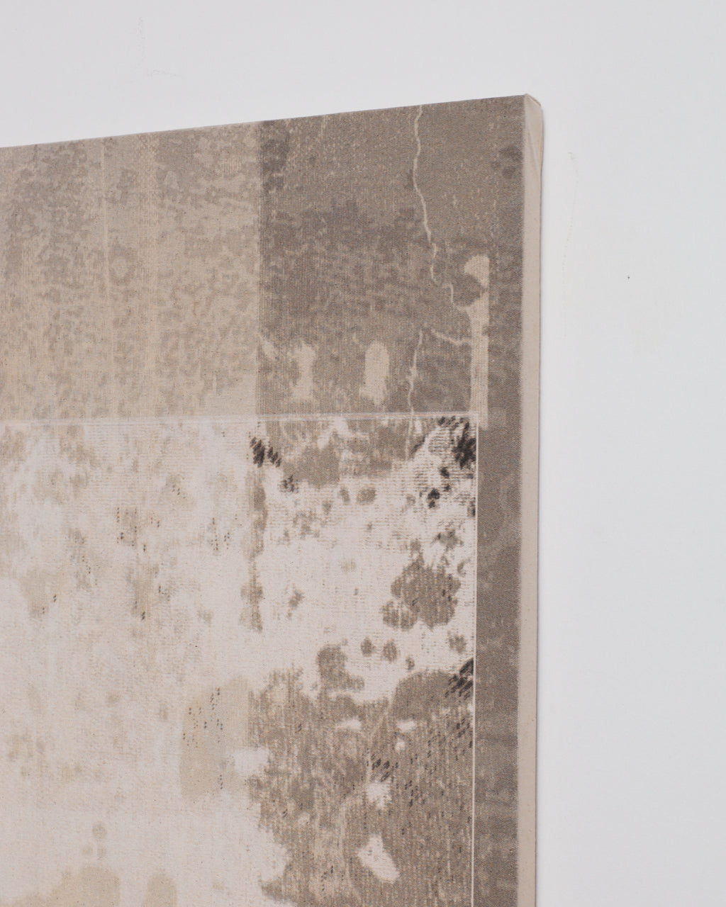 Textured wall panel with a distressed finish on a light gray background