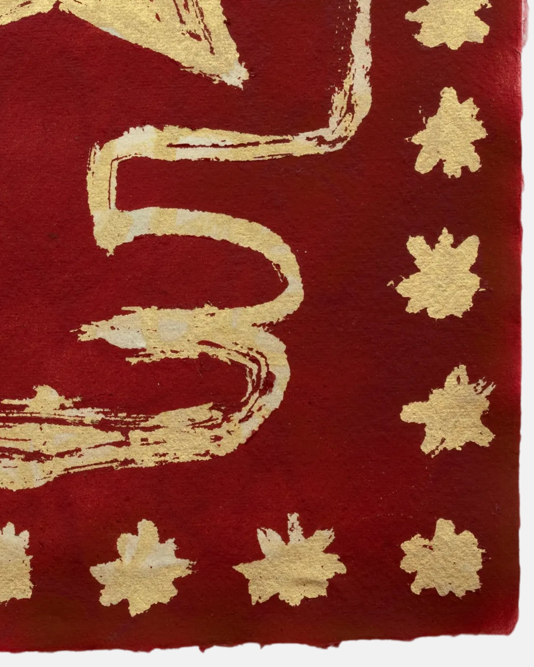 Red fabric with gold abstract patterns