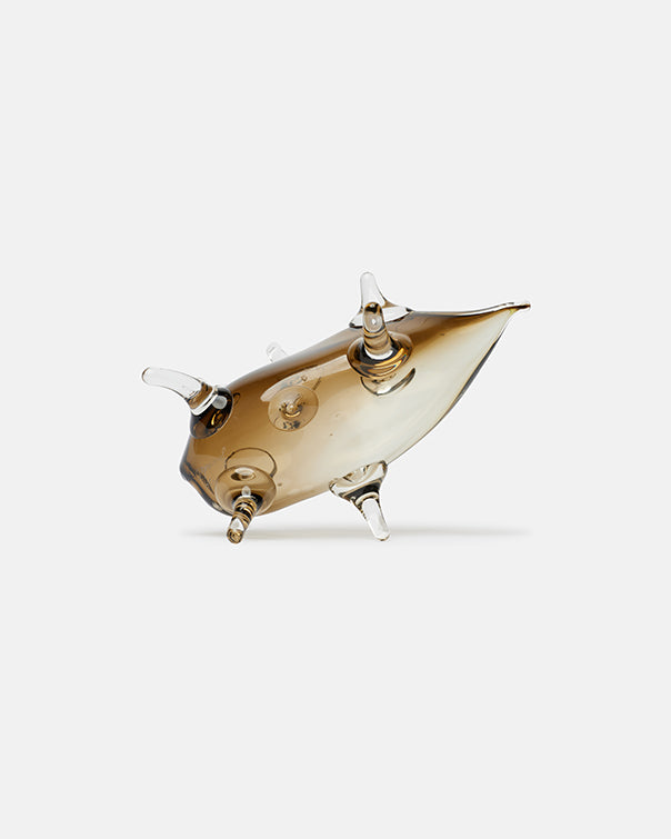 Gold-colored decorative object on a white background