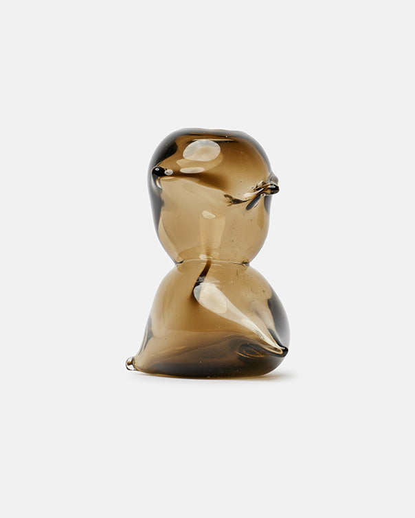 Glass sculpture of a bird on a white background