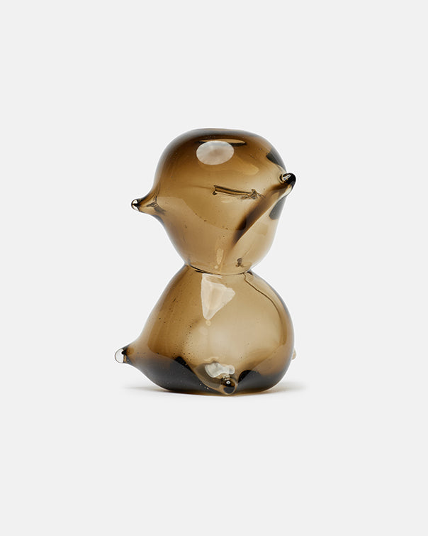 Glass figurine of a bird on a white background