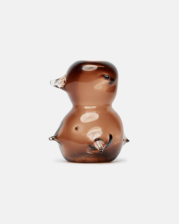 Glass bird-shaped object on a white background