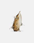 Glass sculpture of a fish on a white background
