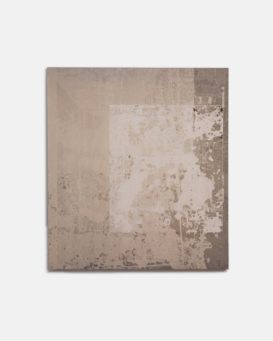 Rectangular area rug with a textured pattern on a plain background