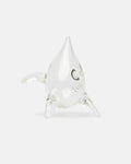 Clear glass narwhal figurine on a white background