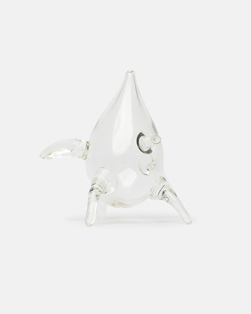 Clear glass narwhal figurine on a white background