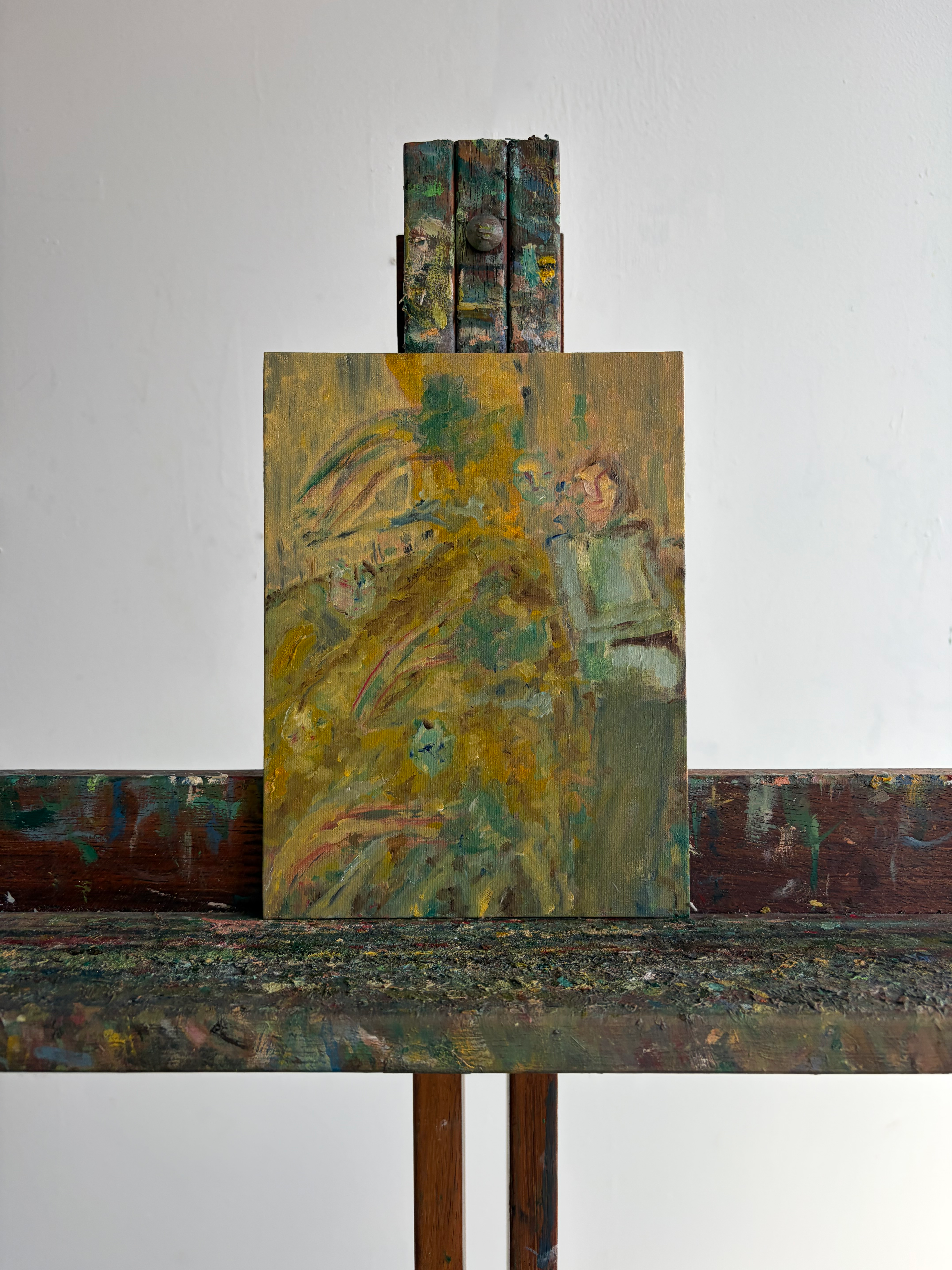 Rustic wooden easel with a textured surface on a plain background