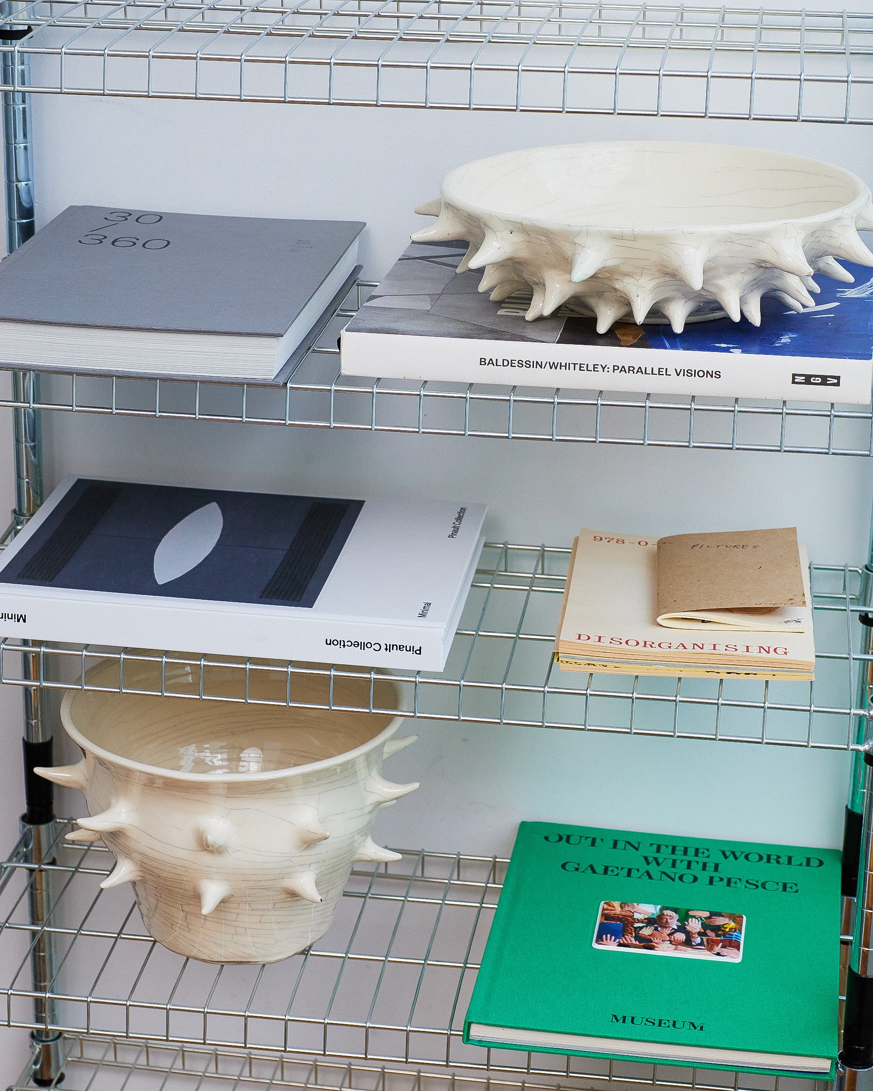 Shelving unit with books and decorative items on a white background