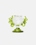 Glass cup with green handles on a white background