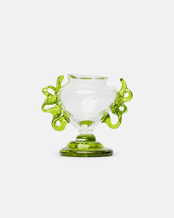 Glass cup with green handles on a white background