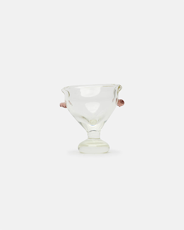 Clear glass cocktail glass on a white background
