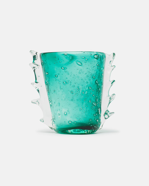 Turquoise glass with wavy design on a white background