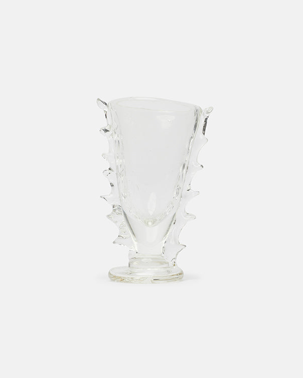 Clear glass vase with textured design on a white background