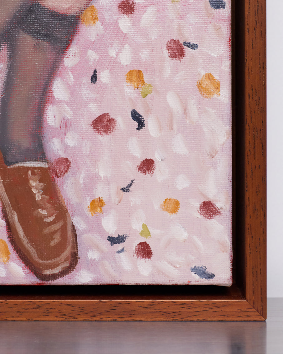Framed artwork of a shoe on a pink background with colorful abstract patterns