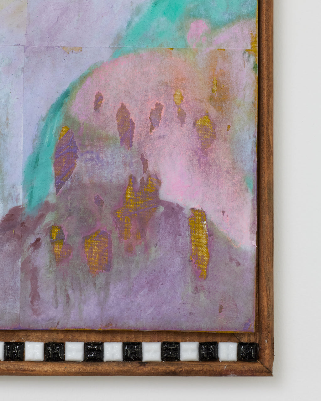 Abstract painting with pastel colors and a wooden frame.