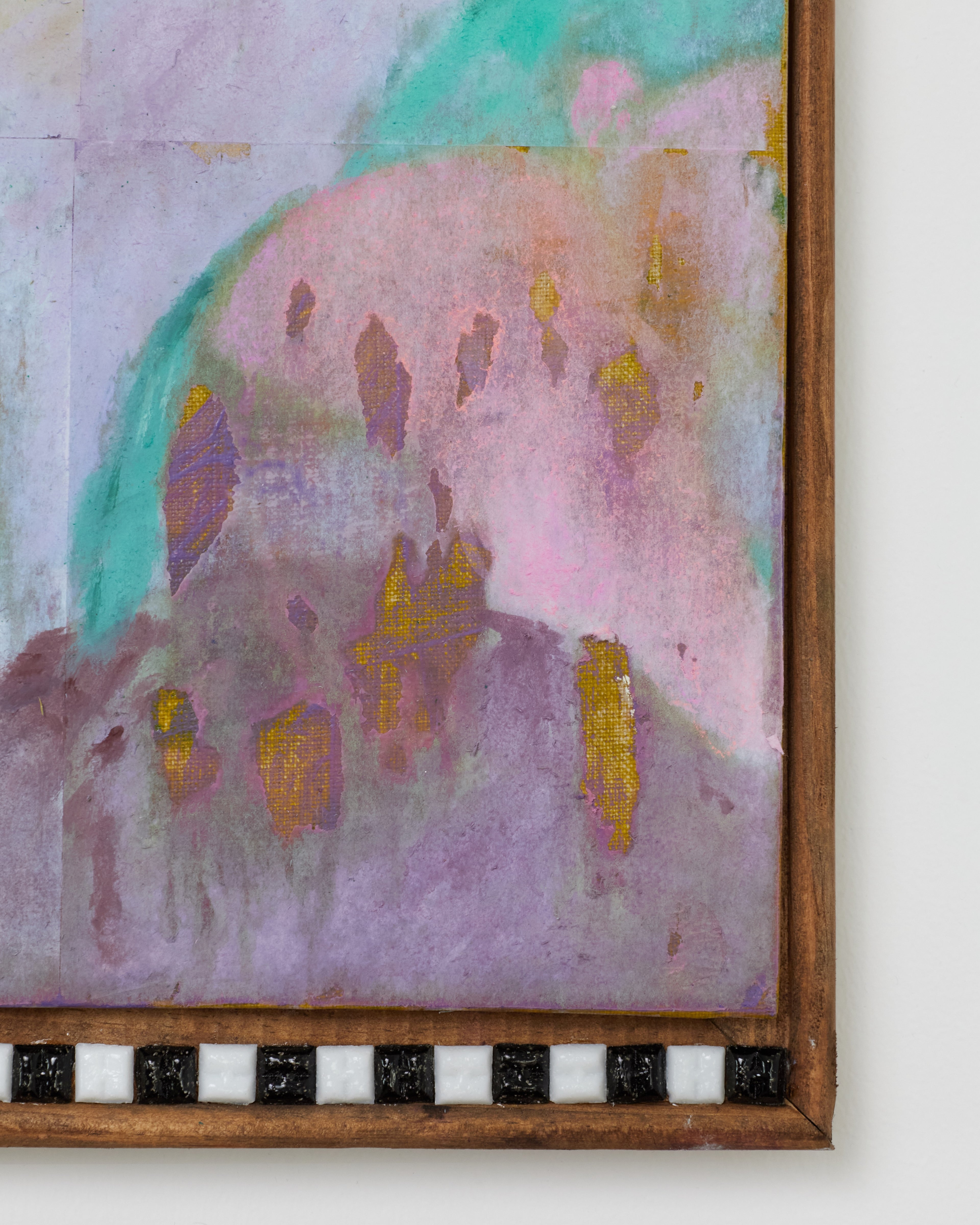 Abstract painting with pastel colors and a wooden frame.