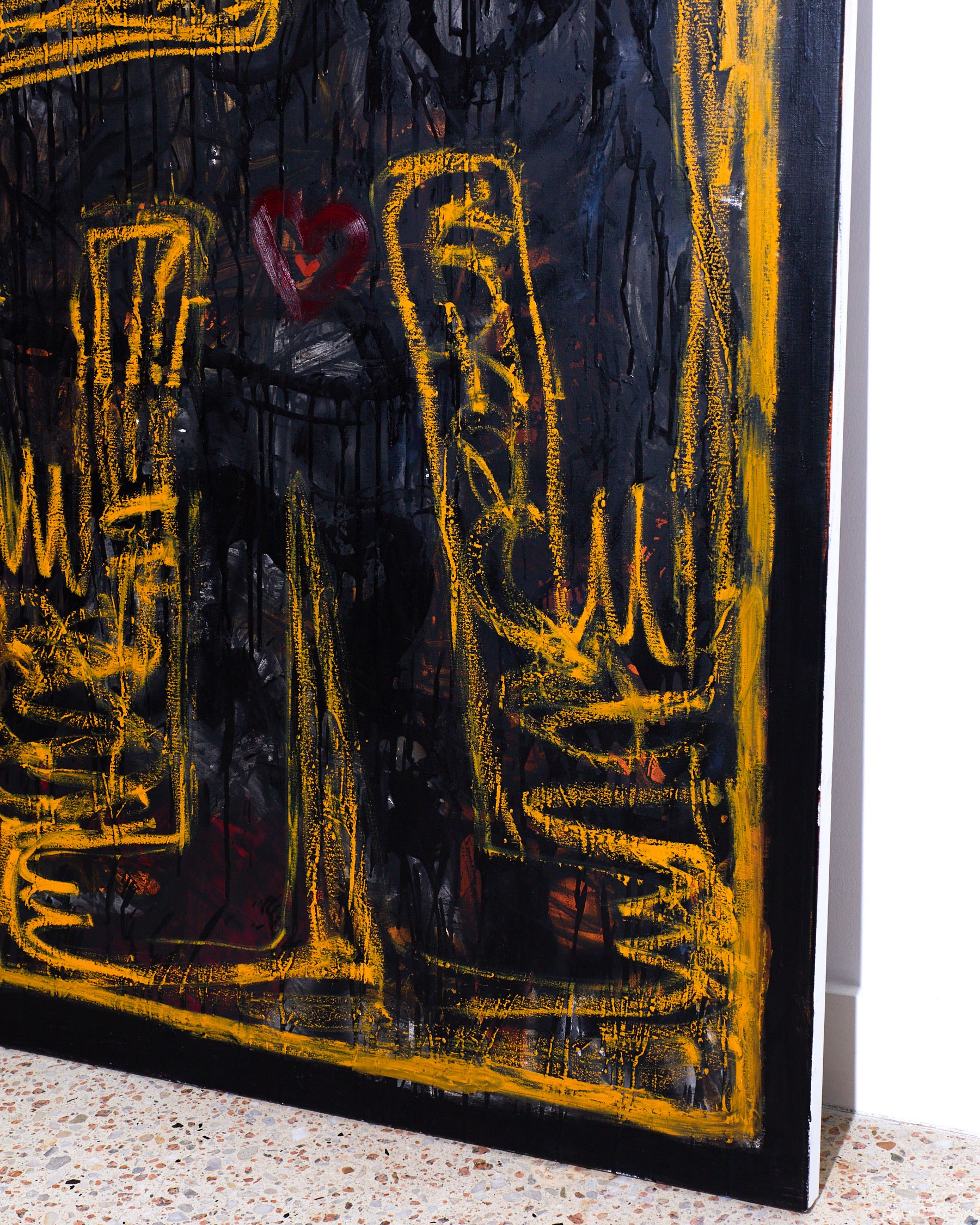 Abstract artwork with yellow lines and a red heart on a dark background