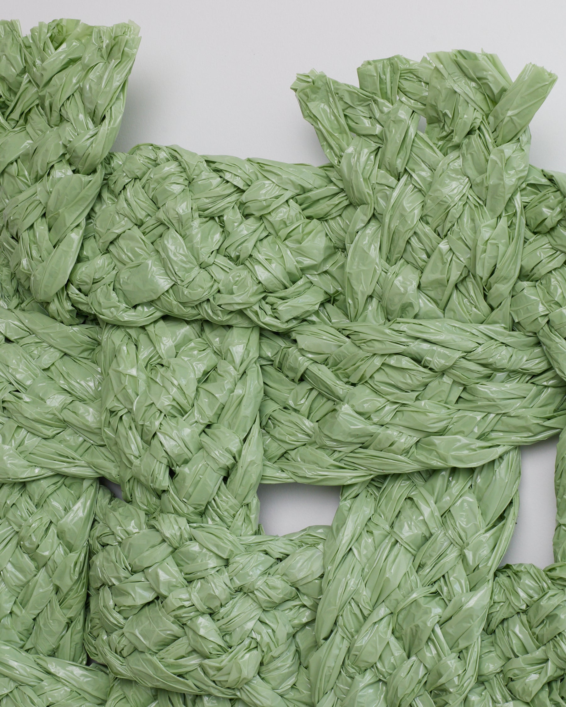 Close-up of green woven material on a white background