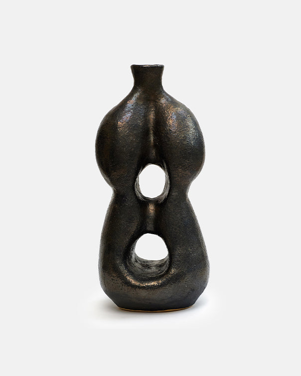 Black ceramic vase with unique design on a white background