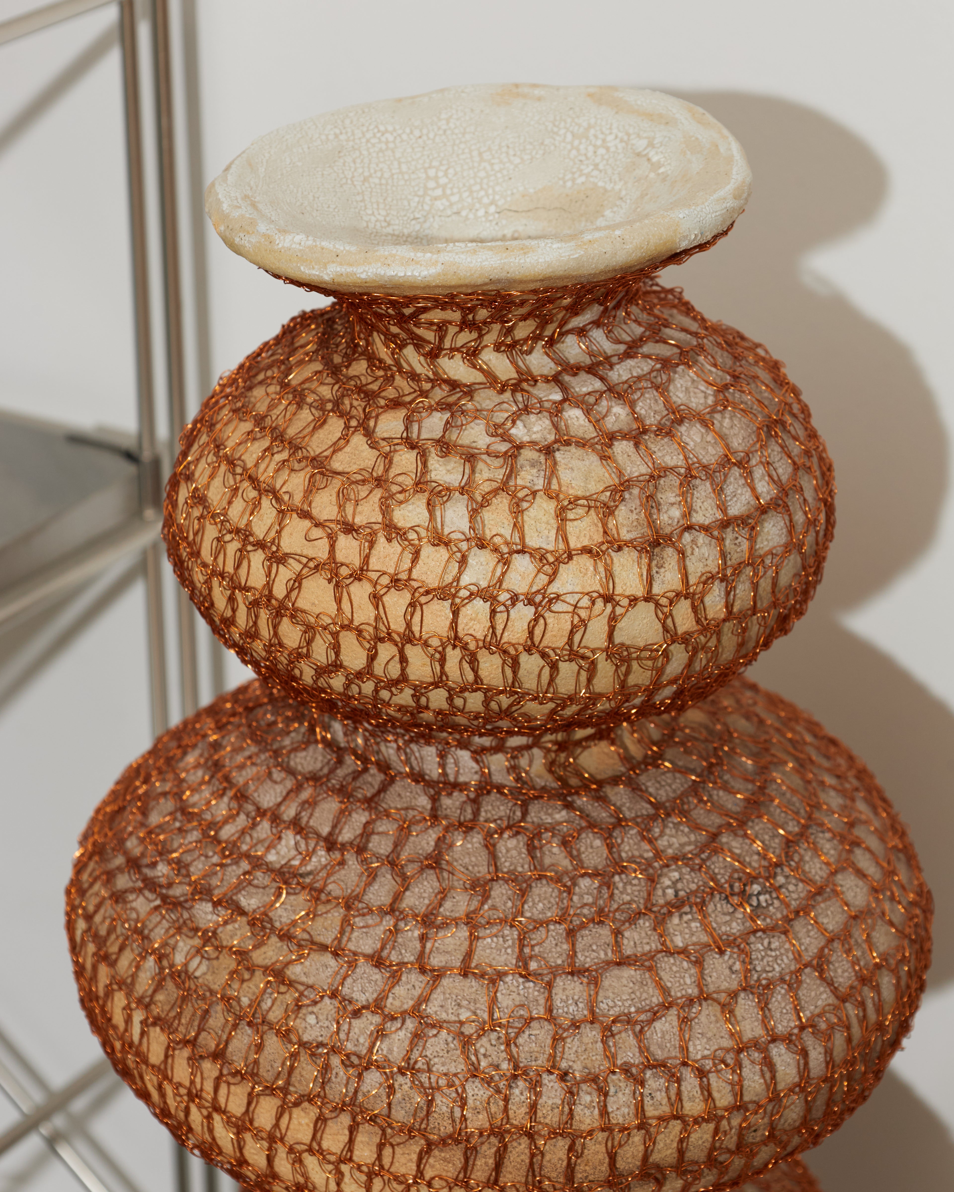 Decorative vase with textured design on a white background